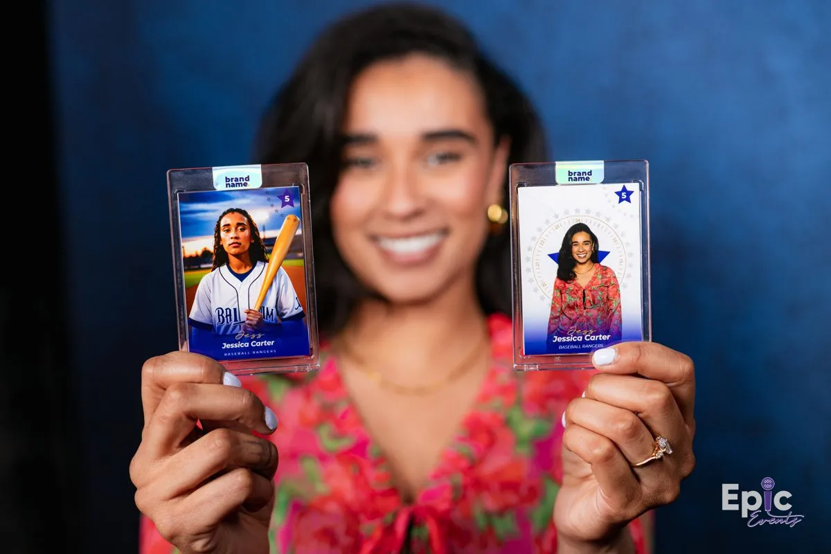 Guests holding AI photo booth trading cards at a DMV corporate event.