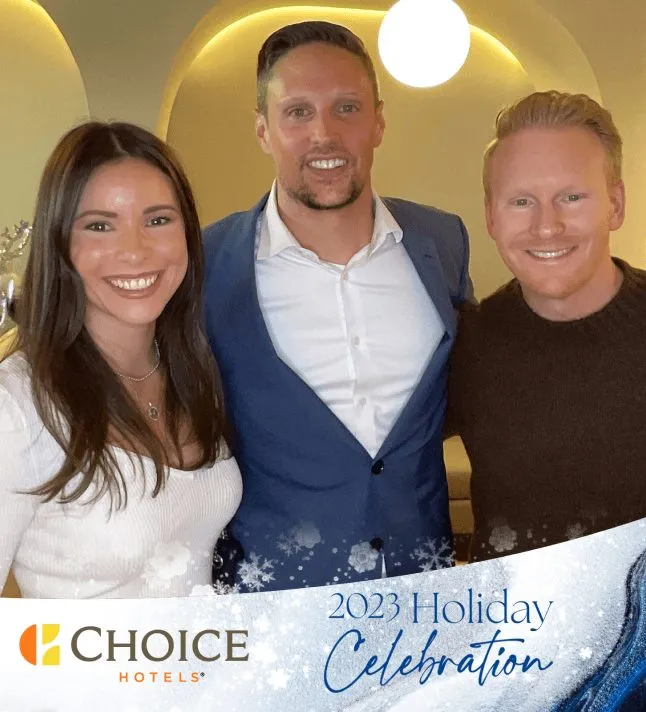 Three guests leaning in together for a roaming photo booth shot on the dance floor.